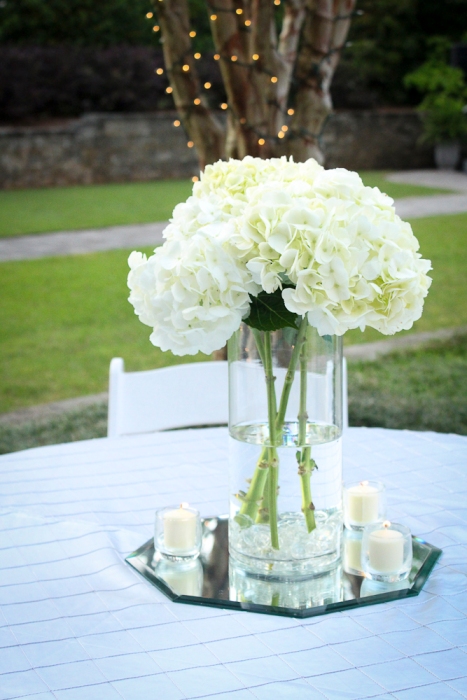 A wedding centerpiece, just outside of the swimming pool! Photo by c2.imageworks